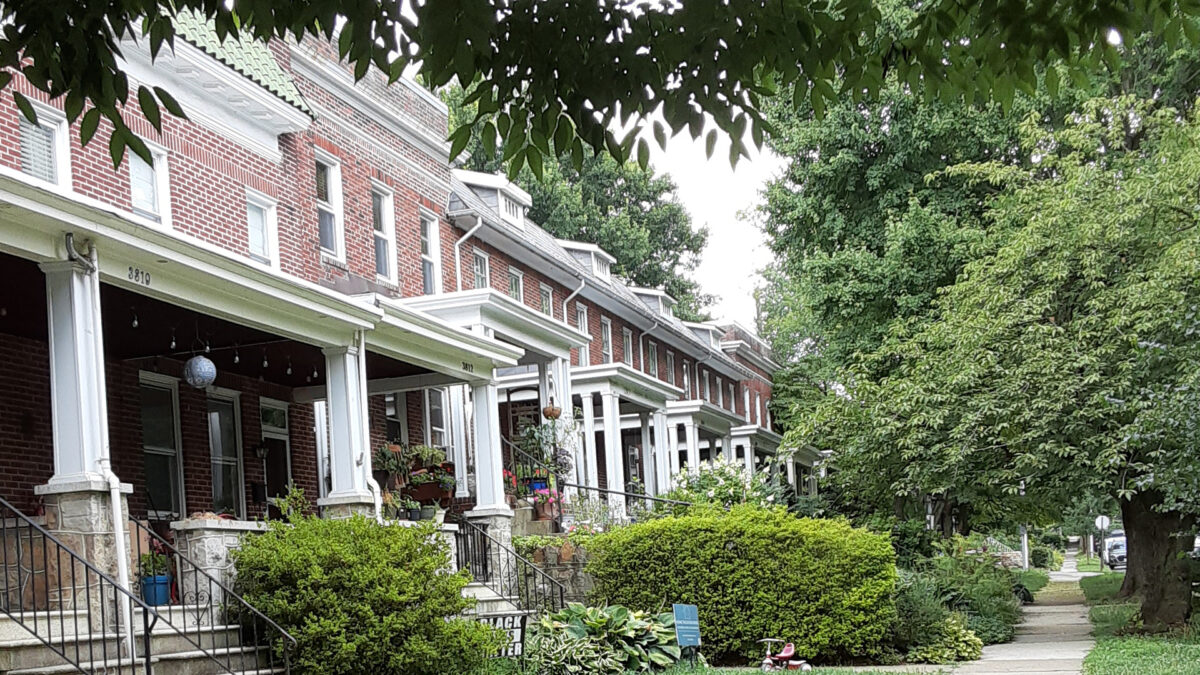 brick rowhouses in a leafy neighborhood
